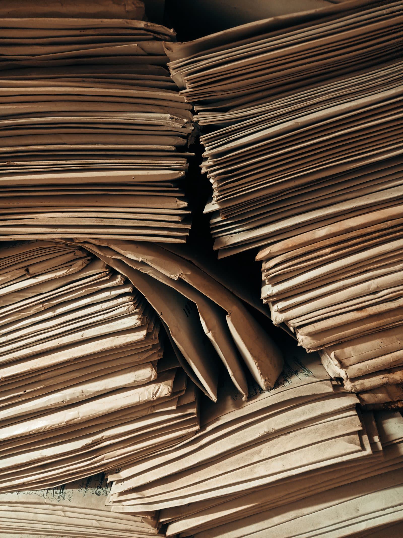 Stacks of kraft paper envelopes