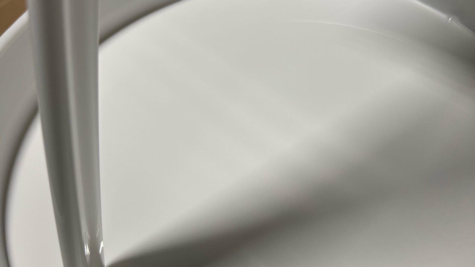 Close-up of white adhesive filling a pail
