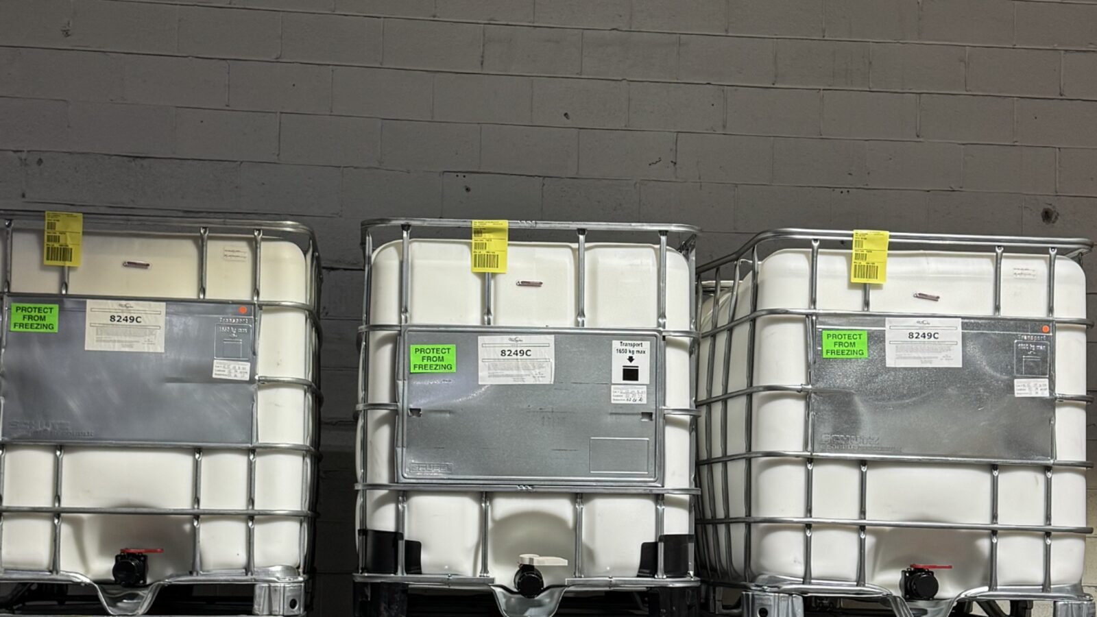 Row of six 8249C IBC totes marked Protect From Freezing